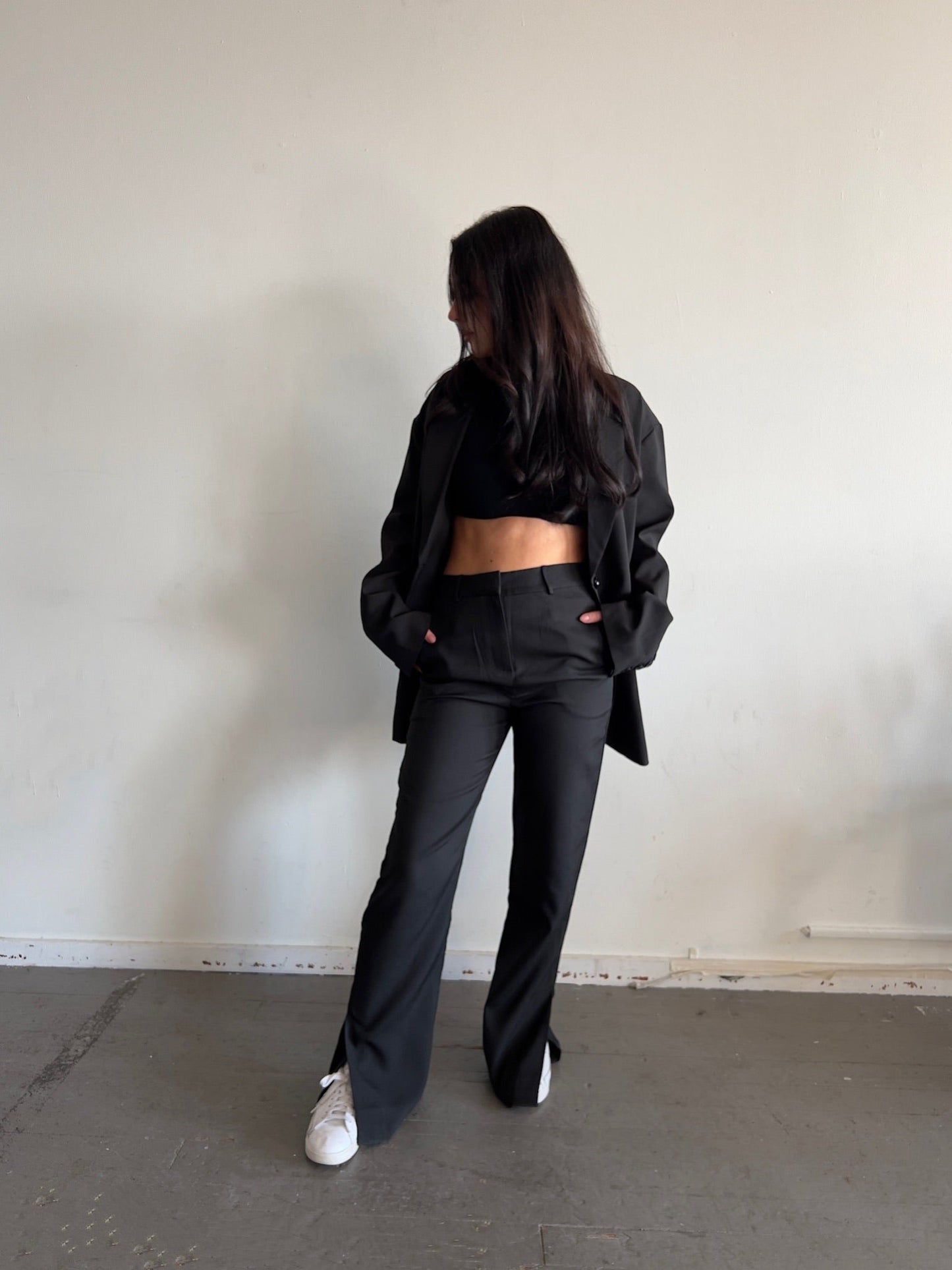 High waisted black pants with bottom slit