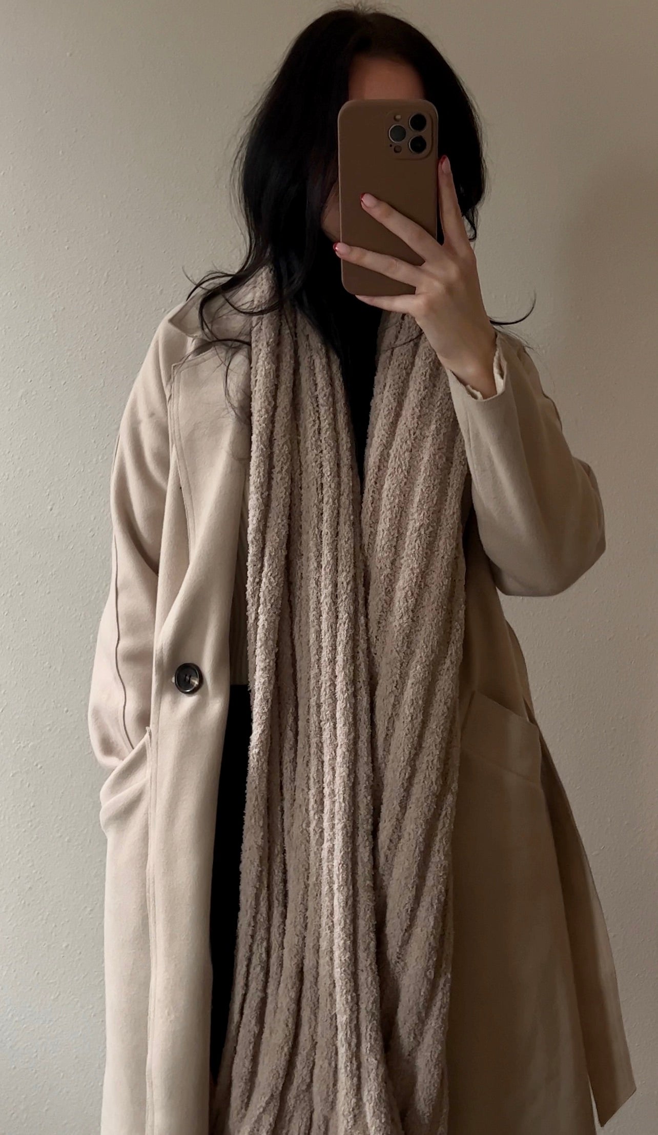 A warm and cozy thick knit scarf in beige