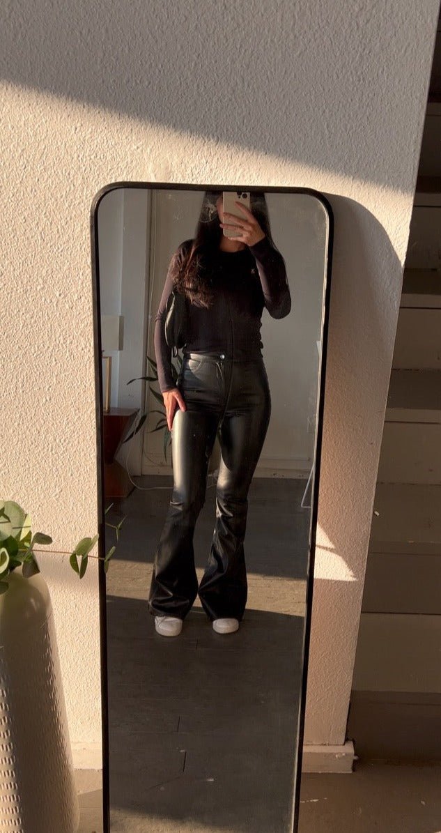 Form fitting, high waisted faux leather black flare pants